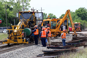 Men and equipment working on railroad